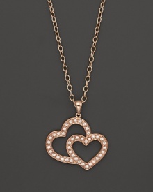Discover the new Frederique Constant Double Heart Jewelry Collection. Perfectly in line with the Frederique Constant timepiece collection, our jewelry designs effortlessly harmonize the classical with the contemporary for a woman who is elegant, yet spontaneous, sophisticated and has a strong sense of herself. With an emphasis on exquisite workmanship, we introduce a jewelry collection that incorporates 18K rose gold and sterling silver with diamonds, offering 'easy,' wearable pieces as an everyday luxury. Designed by a lady, for a lady and developed with passion to reflect the aspirations of today's woman in the spirit of what Frederique Constant is famous for: accessible luxury. 18K rose gold pavé diamond open heart pendant on 18K rose gold chain with logo crest featured at clasp. Discover the new Frederique Constant Double Heart Jewelry Collection. Perfectly in line with the Frederique Constant timepiece collection, our jewelry designs effortlessly harmonize the classical with the contemporary for a woman who is elegant, yet spontaneous, sophisticated and has a strong sense of herself. With an emphasis on exquisite workmanship, we introduce a jewelry collection that incorporates 18K rose gold and sterling silver with diamonds, offering 'easy,' wearable pieces as an everyday luxury. Designed by a lady, for a lady and developed with passion to reflect the aspirations of today's woman in the spirit of what Frederique Constant is famous for: accessible luxury. 18K rose gold pavé diamond open heart pendant on 18K rose gold chain with logo crest featured at clasp.