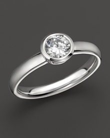 Extraordinary brilliance. This beautifully crafted diamond ring features a bezel-set brilliant round stone.