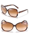 Tory Burch adds her signature look to these oversized sunglasses with metal T detail at temples.