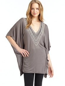 THE LOOKPullover styleV-neck with beaded detailsThree-quarter length dolman sleeves with draped detailTHE FITAbout 32 from shoulder to hemTHE MATERIALViscoseCARE & ORIGINDry cleanImportedModel shown is 5'9½ (176cm) wearing US size Small. 