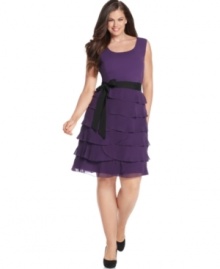 Look dazzling at your next special occasion in Spense's sleeveless plus size dress, beautified by a ruffled skirt.