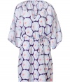 Luxe caftan in fine, pure printed silk - Supremely soft, lightweight material - Chic, multicolor floral motif - Deep v-neck and wide, 3/4 sleeves - Gathered, drawstring waist and tie detail at shoulders - Relaxed cut, hits mid-thigh - Perfect for the beach, holidays and leisure - Pair with a bikini, flat sandals or wedges and a raffia tote