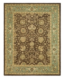 Alluring arabesques weave an inspiring design on this earth-toned area rug from Safavieh. Tufted in India from pure wool, this rug emerges from the annals of antiquity to bring spectacular style and time-honored quality to your home. (Clearance) Alluring arabesques weave an inspiring design on this earth-toned area rug from Safavieh. Tufted in India from pure wool, this rug emerges from the annals of antiquity to bring spectacular style and time-honored quality to your home. (Clearance)