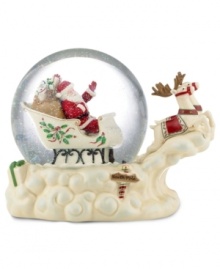 Santa travels in a bubble of pure happiness, listening to music as he soars through the North Pole in this elegant Lenox snow globe. Two reindeer wear holly blankets to match his sleigh. Santa travels in a bubble of pure happiness, listening to music as he soars through the North Pole in this elegant Lenox snow globe. Two reindeer wear holly blankets to match his sleigh.