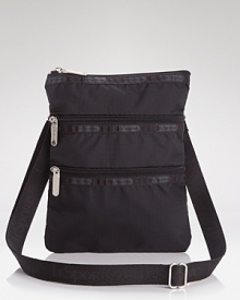 Keep the essentials close with LeSportsac's crossbody bag in matte black nylon; practical interior zip compartments make those daily errands a little bit easier. Keep the essentials close with LeSportsac's crossbody bag in matte black nylon; practical interior zip compartments make those daily errands a little bit easier.