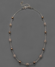 Blazing style by Monet. This Fireball & bead necklace is crafted in mixed metal with bronze glass pearls and topaz-colored crystal accents. Approximate length: 16 inches + 2-inch extender.