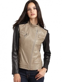 THE LOOKColorblock designStand collar with front snap tabAsymmetrical front zipperDual zip chest pocketsSnap flap chest pocket with rhinestone accentsLong sleeves with knit insets and zip cuffsDual front besom pockets with rhinestone accentsTiered hemQuilted dome inset at backTHE FITAbout 22 from shoulder to hemTHE MATERIALLeatherCombo: rayon/nylon/spandexFully linedCARE & ORIGINDry clean by a leather THE LOOKColorblock designStand collar with front snap tabAsymmetrical front zipperDual zip chest pocketsSnap flap chest pocket with rhinestone accentsLong sleeves with knit insets and zip cuffsDual front besom pockets with rhinestone accentsTiered hemQuilted dome inset at backTHE FITAbout 22 from shoulder to hemTHE MATERIALLeatherCombo: rayon/nylon/spandexFully linedCARE & ORIGINDry clean by a leather