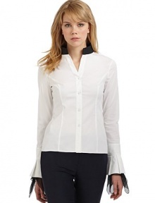 THE LOOKContrast stand collarLong sleeves with pleated cuffsAsymmetric contrast silk ruffles trim the cuffsButton frontTHE FITAbout 22 from shoulder to hemTHE MATERIAL97% cotton/3% other fibersSilk trimCARE & ORIGINDry cleanImportedModel shown is 5'10 (177cm) wearing US size 4. 