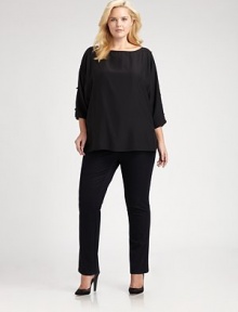 A luxurious style made from matte silk and featuring elegant embellishments. Pair this relaxed-fit blouse with slim-fitting pants or skinny jeans.Round neckCold shouldersEmbellishments along three-quarter sleevesPull-on styleSide slitsAbout 24 from shoulder to hemSilkDry cleanImported