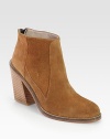 Ankle-grazing suede style with a wide, stacked heel, convenient back zipper and leather trim. Stacked heel, 3 (75mm)Suede upper with leather trimBack zipperLeather lining and solePadded insoleImportedOUR FIT MODEL RECOMMENDS ordering true whole size; ½ sizes should order the next whole size up. 