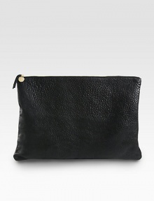 Designed with a chic, pared-down aesthetic in mind, this pebble-grain leather clutch is large enough to tote a laptop and so much more.Top zipperCotton lining17W X 11½H X ½DMade in USA Designed with a chic, pared-down aesthetic in mind, this pebble-grain leather clutch is large enough to tote a laptop and so much more.Top zipperCotton lining17W X 11½H X ½DMade in USA