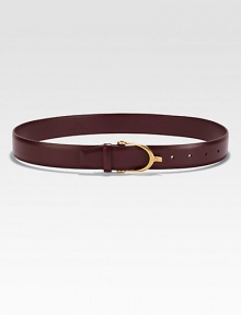 A smooth calfskin style embellished with shiny brass hardware. Calfskin with shiny brass hardwareNon-G adjustable buckleSits on the waistWidth, about 1.4Made in ItalyPlease note: We recommended sizing up two sizes. A smooth calfskin style embellished with shiny brass hardware. Calfskin with shiny brass hardwareNon-G adjustable buckleSits on the waistWidth, about 1.4Made in ItalyPlease note: We recommended sizing up two sizes.