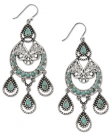 Southwestern simplicity gets some uptown allure with these earthy and elegant chandelier earrings from Lucky Brand. The semi-precious turquoise stones pair well with dark denim or a little black dress. Crafted in silver tone mixed metal. Approximate drop: 3-1/2 inches. Southwestern simplicity gets some uptown allure with these earthy and elegant chandelier earrings from Lucky Brand. The semi-precious turquoise stones pair well with dark denim or a little black dress. Crafted in silver tone mixed metal. Approximate drop: 3-1/2 inches.