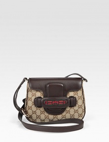 Original GG canvas with signature web detail and leather trim. Adjustable leather shoulder strap, 20-22 dropMagnetic flap closureTwo inside open pocketsNatural cotton linen lining8½W X 6H X 1½DMade in Italy Original GG canvas with signature web detail and leather trim. Adjustable leather shoulder strap, 20-22 dropMagnetic flap closureTwo inside open pocketsNatural cotton linen lining8½W X 6H X 1½DMade in Italy