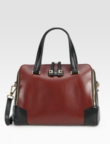 Traditional structured shape of sumptuous leather in contrasting tones, topped with gleaming goldtone hardware. Adjustable detachable shoulder strap, 11-12½ dropDouble top handles, 7 dropTop zip closureOne outside back zip pocketOne inside zip pocketThree inside open pocketsLeather lining13¾W X 10H X 6DImported Traditional structured shape of sumptuous leather in contrasting tones, topped with gleaming goldtone hardware. Adjustable detachable shoulder strap, 11-12½ dropDouble top handles, 7 dropTop zip closureOne outside back zip pocketOne inside zip pocketThree inside open pocketsLeather lining13¾W X 10H X 6DImported