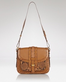 Embrace an exotic mood with this croc and python saddle bag from Michael Kors. This bag's potent patchwork of leathers is a luxe way to take on texture. Embrace an exotic mood with this croc and python saddle bag from Michael Kors. This bag's potent patchwork of leathers is a luxe way to take on texture.