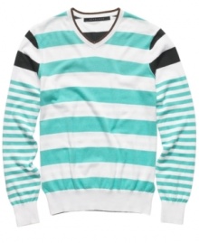 Stripe it rich in your seasonal wardrobe with this bold sweater from Sean John.