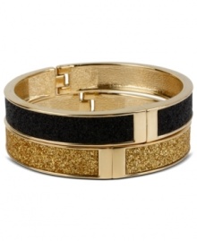 A totally dynamic duo. Betsey Johnson's two bangle set makes quite the statement in chic, contrasting colors. Crafted in gold tone mixed metal with a glitter overlay and secure hinge clasp. Approximate length: 8 inches. Approximate diameter: 2-3/8 inches.