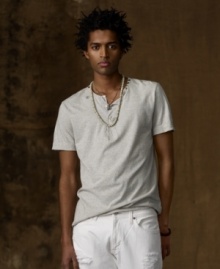 A wear-it-anywhere Henley in lightweight cotton jersey features weathered tribal prints and vintage metal studs for an outdoor-meets-urban vibe. A wear-it-anywhere Henley in lightweight cotton jersey features weathered tribal prints and vintage metal studs for an outdoor-meets-urban vibe.
