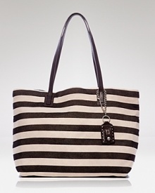 The classic canvas tote is synonymous with timeless style. With leather trims and bold stripes, this style from Olivia Harris is a luxe version. The classic canvas tote is synonymous with timeless style. With leather trims and bold stripes, this style from Olivia Harris is a luxe version.