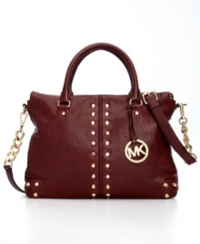 Elegance with attitude, this classic silhouette from MICHAEL Michael Kors is outfitted with golden stud accents and signature hardware. Crafted from butter-soft leather with a pocket-trimmed interior, it's the perfect go-to accessory of the season. Elegance with attitude, this classic silhouette from MICHAEL Michael Kors is outfitted with golden stud accents and signature hardware. Crafted from butter-soft leather with a pocket-trimmed interior, it's the perfect go-to accessory of the season.