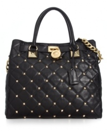 Elegance with an edge. Stud accents and chain-link detailing give this classic quilted tote from MICHAEL Michael Kors uptown rocker-chic appeal. Spacious, versatile and destined to be your go-to silhouette of the season. Elegance with an edge. Stud accents and chain-link detailing give this classic quilted tote from MICHAEL Michael Kors uptown rocker-chic appeal. Spacious, versatile and destined to be your go-to silhouette of the season.