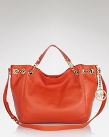 Complete a classic look with this leather tote from MICHAEL Michael Kors. A simple yet spacious design and subtle logo detailing make this understated classic an ever-chic piece. Complete a classic look with this leather tote from MICHAEL Michael Kors. A simple yet spacious design and subtle logo detailing make this understated classic an ever-chic piece.