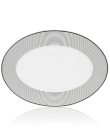 Have fun with the graphic rings and serious durability of Mikasa's Cheers oval platter. Bone china in black and white caters modern tables with a sense of whimsy. Have fun with the graphic rings and serious durability of Mikasa's Cheers oval platter. Bone china in black and white caters modern tables with a sense of whimsy.