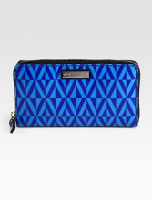 A slim zip-around design of coated fabric with an eye-catching geometric print. Zip-around closureOne inside zip pocketTwo bill compartmentsTwelve credit card slotsFully lined7½W X 4½H X 1DImported A slim zip-around design of coated fabric with an eye-catching geometric print. Zip-around closureOne inside zip pocketTwo bill compartmentsTwelve credit card slotsFully lined7½W X 4½H X 1DImported