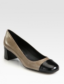 Sophisticated leather essential with a patent leather cap toe and elevated block heel. Lacquered heel with patent leather insert, 2 (50mm)Leather and patent leather upperLeather liningRubber solePadded insoleMade in Italy Sophisticated leather essential with a patent leather cap toe and elevated block heel. Lacquered heel with patent leather insert, 2 (50mm)Leather and patent leather upperLeather liningRubber solePadded insoleMade in Italy