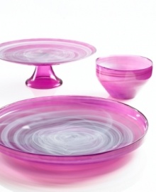 Adding a fun shock of color to modern settings, the small Sweet Plum bowl from Sea Glasbruk pairs luminous violet with swirls of white in handcrafted glass.