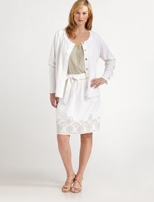 A combed cotton sweater that will add ladylike charm to your wardrobe, thanks to pretty eyelet and crinkle chiffon details. You'll instantly fall for its flattering fit and layering capabilities.Ruffles at round neckLong sleevesSnap frontRuffle and eyelet details on frontAbout 25 from shoulder to hemCottonHand washImported A combed cotton sweater that will add ladylike charm to your wardrobe, thanks to pretty eyelet and crinkle chiffon details. You'll instantly fall for its flattering fit and layering capabilities.Ruffles at round neckLong sleevesSnap frontRuffle and eyelet details on frontAbout 25 from shoulder to hemCottonHand washImported