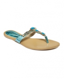 Dripping in jewels. Nine West's Evania flat thong sandals feature beautiful rhinestones along the vamp. They'll add instant glam to everything from bathing suits to dresses.