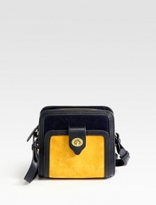 A demure silhouette of rich suede and leather trim, finished with an outside turnlock pocket for versatile ease.Adjustable shoulder strap, 21-23 dropTop zip closureOne outside turnlock pocketOne inside zip pocketCotton lining7½W X 7¾H X 3½DImported A demure silhouette of rich suede and leather trim, finished with an outside turnlock pocket for versatile ease.Adjustable shoulder strap, 21-23 dropTop zip closureOne outside turnlock pocketOne inside zip pocketCotton lining7½W X 7¾H X 3½DImported