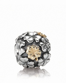 This PANDORA charm is lucky find -- a sterling silver field of clovers with four-leaf varieties in 14K gold. This PANDORA charm is lucky find -- a sterling silver field of clovers with four-leaf varieties in 14K gold.