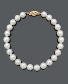 A classic look for the sophisticated woman. This elegant strand features A quality cultured freshwater pearls (6-7mm) and a 14k gold clasp. Approximate length: 7-1/2 inches. A classic look for the sophisticated woman. This elegant strand features A quality cultured freshwater pearls (6-7mm) and a 14k gold clasp. Approximate length: 7-1/2 inches.