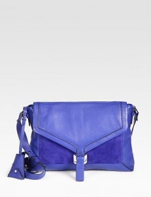 A bold and striking style in supple leather and soft suede; perfect for carrying your iPad®.Adjustable shoulder strap, 17½-20 dropBuckled flap closureOne compartment for iPad®One open pocket under flapOne inside zip pocketThree inside open pocketsFully lined14W X 9½H X 1½DImported A bold and striking style in supple leather and soft suede; perfect for carrying your iPad®.Adjustable shoulder strap, 17½-20 dropBuckled flap closureOne compartment for iPad®One open pocket under flapOne inside zip pocketThree inside open pocketsFully lined14W X 9½H X 1½DImported