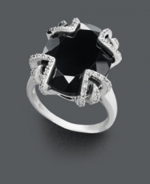 Not for the shy, this bold style makes a spectacular statement! Crafted in sterling silver, a large onyx center stone (12-1/3 ct. t.w.) is the focal point against a diamond dusted (1/10 ct. t.w.) prong setting. Size 7. Not for the shy, this bold style makes a spectacular statement! Crafted in sterling silver, a large onyx center stone (12-1/3 ct. t.w.) is the focal point against a diamond dusted (1/10 ct. t.w.) prong setting. Size 7.