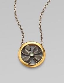 From the Clovers Collection. A graceful clover design in two tones with a softly hued green tsavorite garnet in the center, on a sterling silver chain.Tsavorite garnetGoldplated sterling silver and dark rhodium-plated sterling silverChain length, about 16-18 (adjustable)Pendant diameter, about ¾Lobster claspImported From the Clovers Collection. A graceful clover design in two tones with a softly hued green tsavorite garnet in the center, on a sterling silver chain.Tsavorite garnetGoldplated sterling silver and dark rhodium-plated sterling silverChain length, about 16-18 (adjustable)Pendant diameter, about ¾Lobster claspImported
