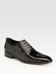 The classic lace-up crafted from sleek patent leather and rich grosgrain trim.Patent leather upperLeather liningPadded insoleLeather soleMade in Italy