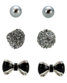 Style in the making. Create a new look every day in GUESS's mix and matchable three pair earring set. Earring set features a pair of shiny glass pearls, a crystal-encrusted cone stud, and black epoxy bows. Set in silver and hematite tone mixed metal. Approximate diameters: 6 mm (pearl); 3/8 inch (cone stud); 3/8 x 5/8 inch (bow stud). Style in the making. Create a new look every day in GUESS's mix and matchable three pair earring set. Earring set features a pair of shiny glass pearls, a crystal-encrusted cone stud, and black epoxy bows. Set in silver and hematite tone mixed metal. Approximate diameters: 6 mm (pearl); 3/8 inch (cone stud); 3/8 x 5/8 inch (bow stud).