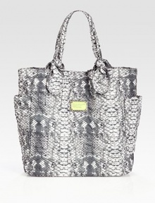Signature letter stitching defines this printed nylon carryall, finished with oversized pockets and elegantly knotted handles.Shoulder straps, 8 dropMagnetic top closureTwo outside open pocketsOne inside zip pocketTwo inside open pocketsPrinted nylon lining14½W X 15H X 4½DImported Signature letter stitching defines this printed nylon carryall, finished with oversized pockets and elegantly knotted handles.Shoulder straps, 8 dropMagnetic top closureTwo outside open pocketsOne inside zip pocketTwo inside open pocketsPrinted nylon lining14½W X 15H X 4½DImported
