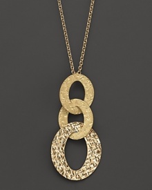 From the Chic & Shine collection, an 18K yellow gold disk pendant necklace in a modern mix of finishes. By Roberto Coin.