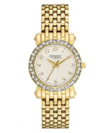 Indulge yourself with the sparkle and shine of this chic watch by Caravelle by Bulova. Gold tone mixed metal bracelet and case. Bezel embellished with crystal accents. Textured silver tone dial features gold tone numerals at markers, minute track, three hands and logo. Quartz movement. Water resistant to 30 meters. Two-year limited warranty. Indulge yourself with the sparkle and shine of this chic watch by Caravelle by Bulova. Gold tone mixed metal bracelet and case. Bezel embellished with crystal accents. Textured silver tone dial features gold tone numerals at markers, minute track, three hands and logo. Quartz movement. Water resistant to 30 meters. Two-year limited warranty.