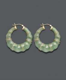 Good luck and great style combine in these unique hoop earrings. Crafted from solid jade (68 mm), earrings feature a bamboo-style pattern with 14k gold accents and backing. Approximate diameter: 1-1/2 inches.