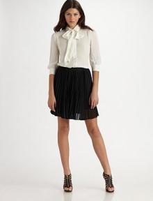Crisp knife-pleats shape polyester crepe in this kicky A-line silhouette.Side zipper About 19 long Polyester Dry clean Imported Crisp knife-pleats shape polyester crepe in this kicky A-line silhouette.Side zipper About 19 long Polyester Dry clean Imported