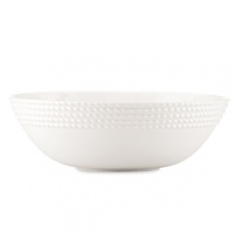 Decorated on the exterior with a twist design that's reminiscent of nautical ropes, this alluring serving bowl offers simple elegance and modern appeal for all your dinner presentations.