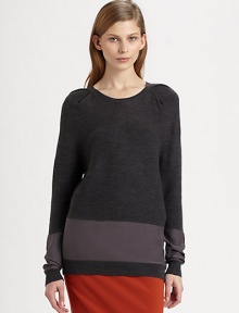 Lengthy, featherweight sweater of merino wool has pleated shoulders and glistening silk panels. RoundneckPleated shouldersLong sleeves with silk panelsSilk panel at hipsLonger length hits below the hipsBody: Merino wool; Contrast: SilkDry cleanImportedModel shown is 5'10 (177cm) wearing US size Small.