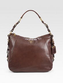 Calfskin in a slouchy top handle carryall.Top handle, 7½ dropTop-zip closureMetal lettering logoBronze hardwareProtective metal feetOne inside zip pocketOne inside open pocketPrada logo lining12½W X 11H X 5½DMade in Italy Calfskin in a slouchy top handle carryall.Top handle, 7½ dropTop-zip closureMetal lettering logoBronze hardwareProtective metal feetOne inside zip pocketOne inside open pocketPrada logo lining12½W X 11H X 5½DMade in Italy