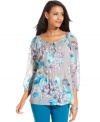 Charter Club's semi-sheer petite top features a floral print for a feminine touch. Pair it with colored jeans for on-trend style.